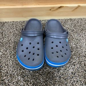 Gray and blue crocs
